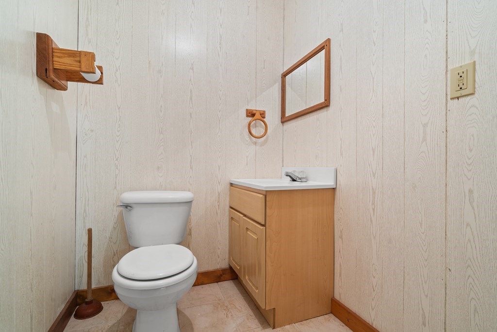 2421 Settlers Ridge Road Hiawassee, GA 30546 - Photo 37 of 46 a bathroom with a toilet sink and mirror