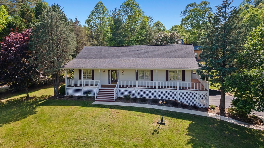 2421 Settlers Ridge Road Hiawassee, GA 30546 - Photo 4 of 46 a front view of a house with swimming pool and porch