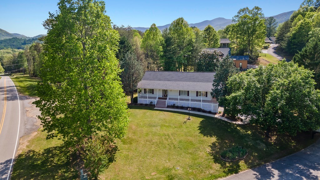 2421 Settlers Ridge Road Hiawassee, GA 30546 - Photo 42 of 46 an aerial view of a house with swimming pool and a yard