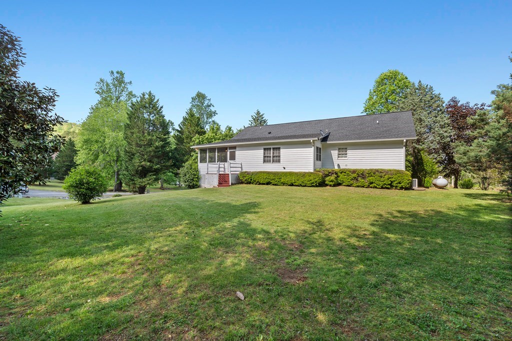 2421 Settlers Ridge Road Hiawassee, GA 30546 - Photo 46 of 46 a front view of house with yard and green space
