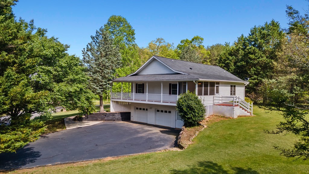 2421 Settlers Ridge Road Hiawassee, GA 30546 - Photo 5 of 46 a front view of a house with garden