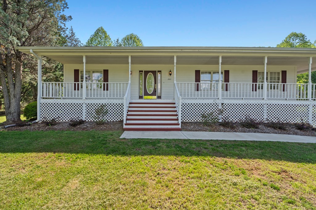 2421 Settlers Ridge Road Hiawassee, GA 30546 - Photo 10 of 46 a front view of a house with a yard