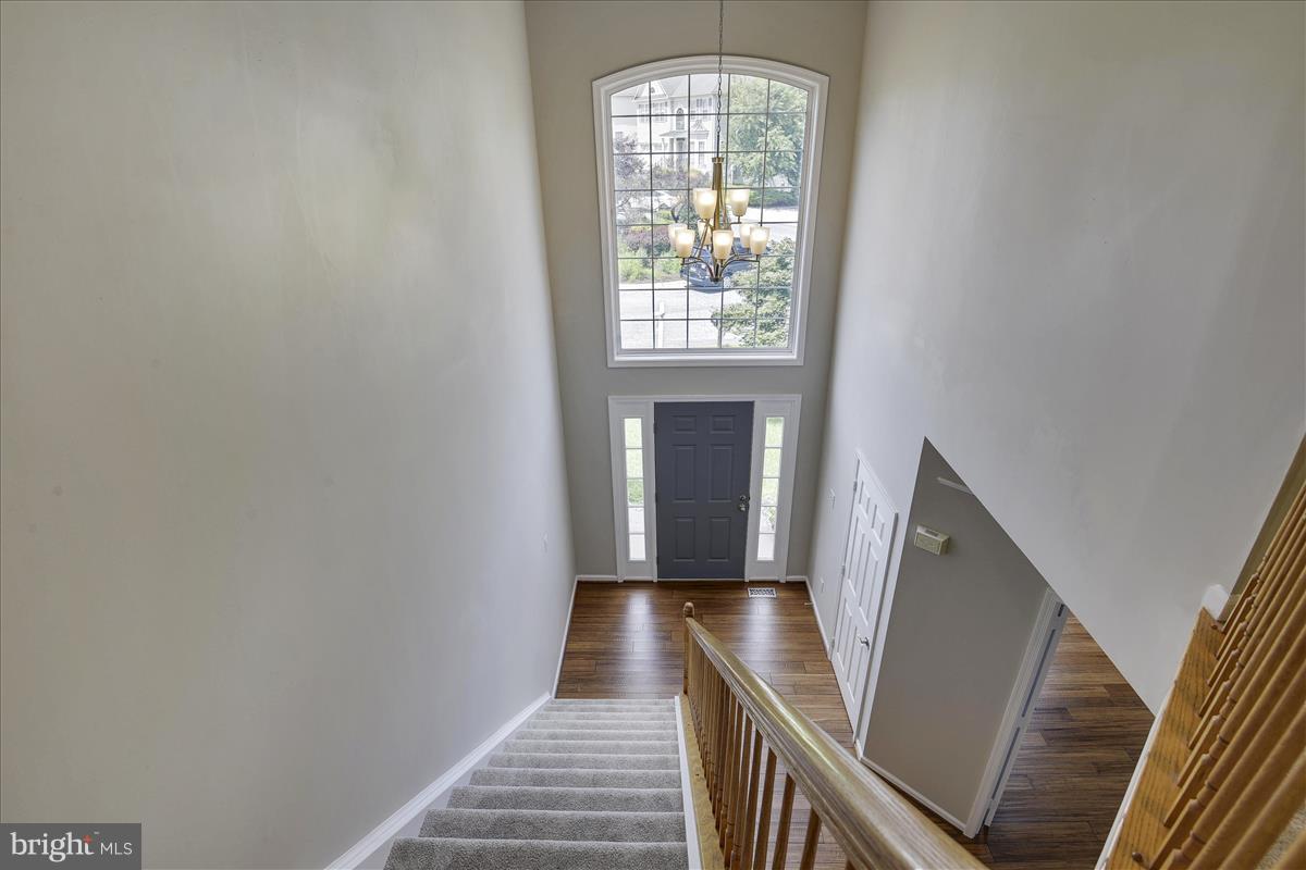 12902 Summit Ridge Terrace Germantown, MD 20874 - Photo 16 of 30 a view of entryway and hall with wooden floor