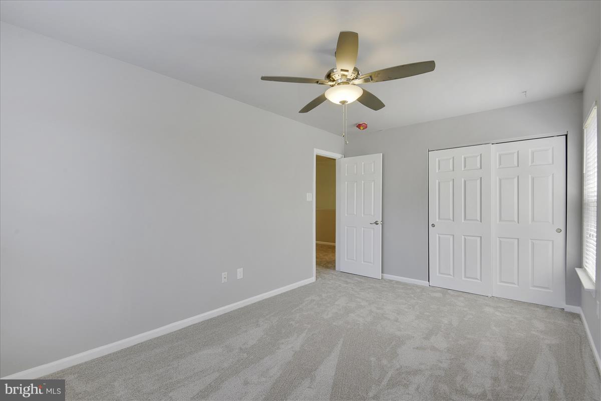 12902 Summit Ridge Terrace Germantown, MD 20874 - Photo 18 of 30 a view of an empty room and chandelier fan