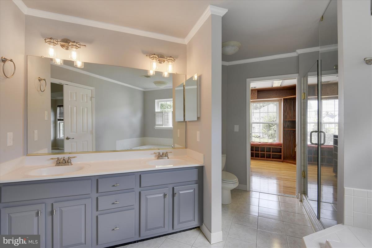 12902 Summit Ridge Terrace Germantown, MD 20874 - Photo 24 of 30 a spacious en suite bathroom with double sink and mirror