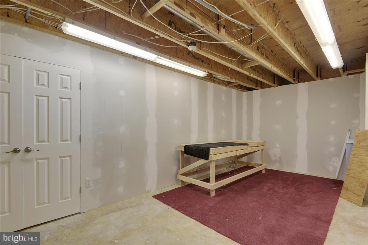 12902 Summit Ridge Terrace Germantown, MD 20874 - Photo 30 of 30 a view of an empty room with wooden floor