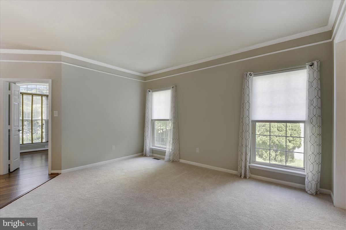 12902 Summit Ridge Terrace Germantown, MD 20874 - Photo 7 of 30 a view of an empty room with a window