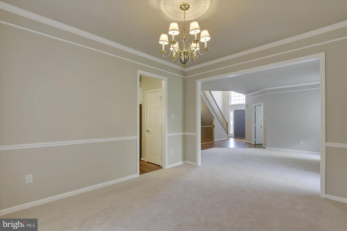 12902 Summit Ridge Terrace Germantown, MD 20874 - Photo 8 of 30 a view of a chandelier in big room and chandelier
