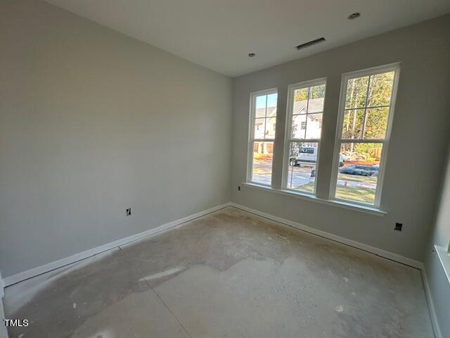 7701 Litcham Drive Raleigh, NC 27615 - Photo 11 of 58 an empty room with a window