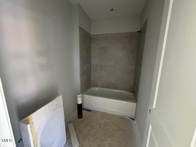 7701 Litcham Drive Raleigh, NC 27615 - Photo 14 of 58 a bathroom with a bathtub