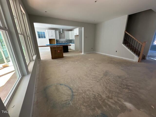 7701 Litcham Drive Raleigh, NC 27615 - Photo 17 of 58 a view of a living room with a fireplace