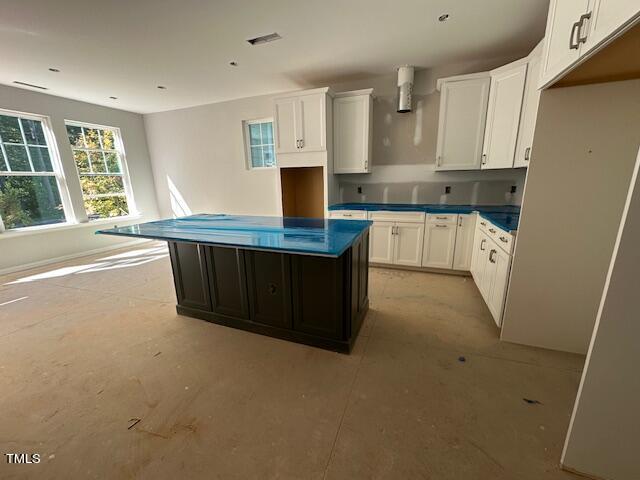 7701 Litcham Drive Raleigh, NC 27615 - Photo 21 of 58 a kitchen with stainless steel appliances a refrigerator sink and cabinets
