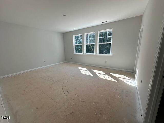 7701 Litcham Drive Raleigh, NC 27615 - Photo 31 of 58 a view of empty room with window