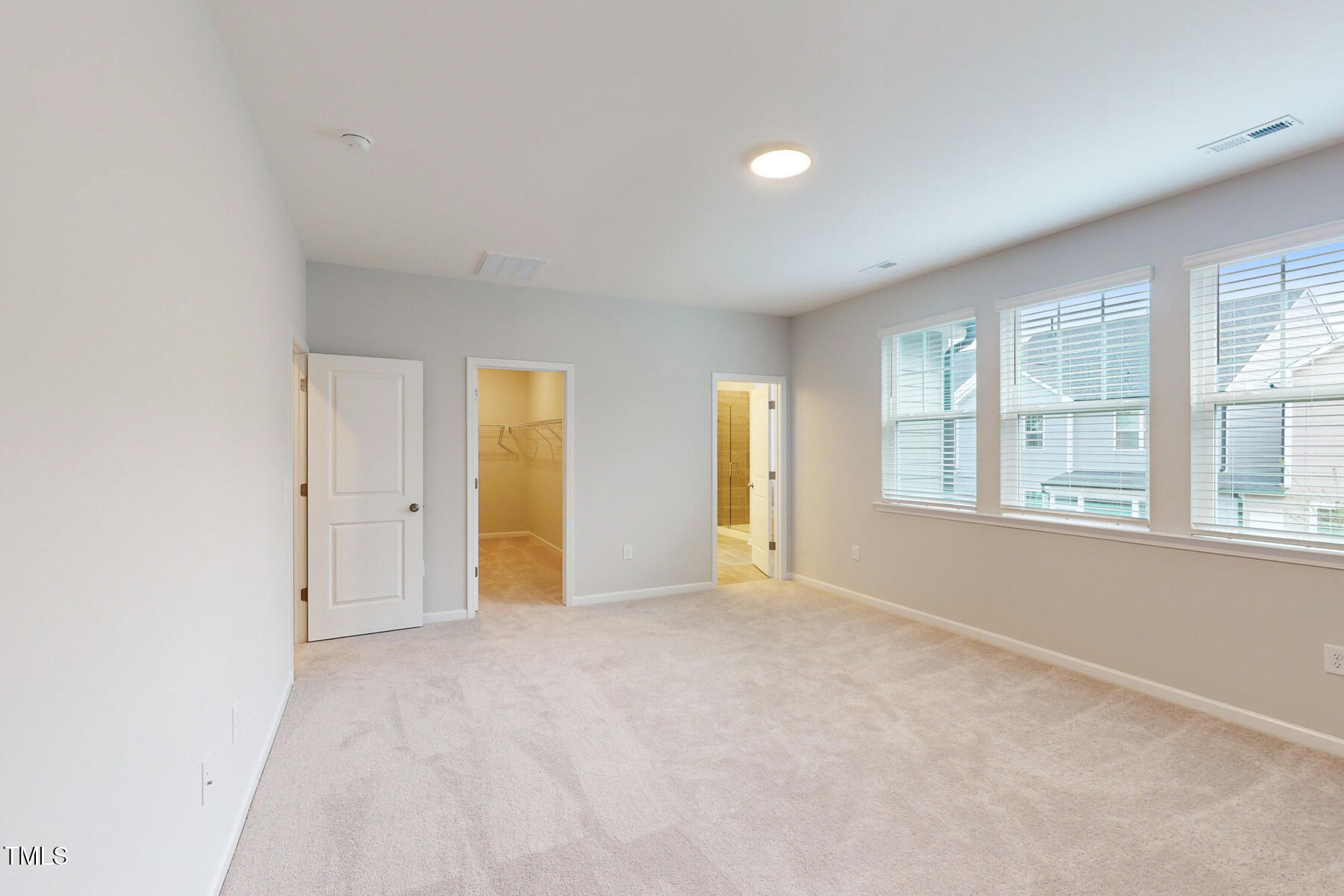 7701 Litcham Drive Raleigh, NC 27615 - Photo 32 of 58 a view of an empty room with a window