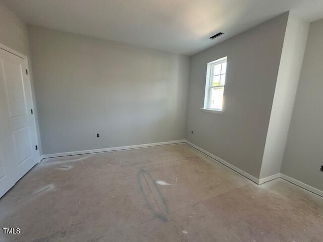 7701 Litcham Drive Raleigh, NC 27615 - Photo 39 of 58 an empty room with a window