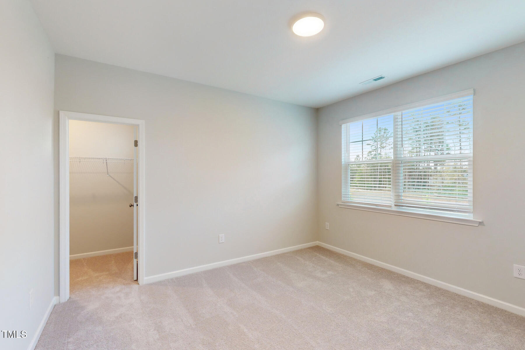 7701 Litcham Drive Raleigh, NC 27615 - Photo 40 of 58 an empty room with a window