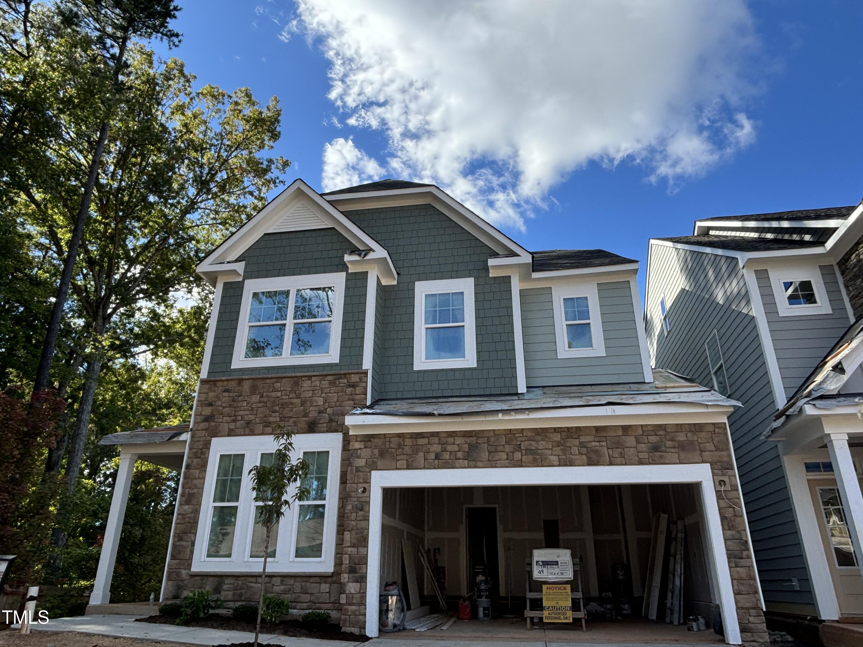 7701 Litcham Drive Raleigh, NC 27615 - Photo 4 of 58 a view of a house with a balcony