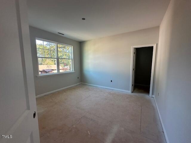 7701 Litcham Drive Raleigh, NC 27615 - Photo 41 of 58 a view of an empty room with a window