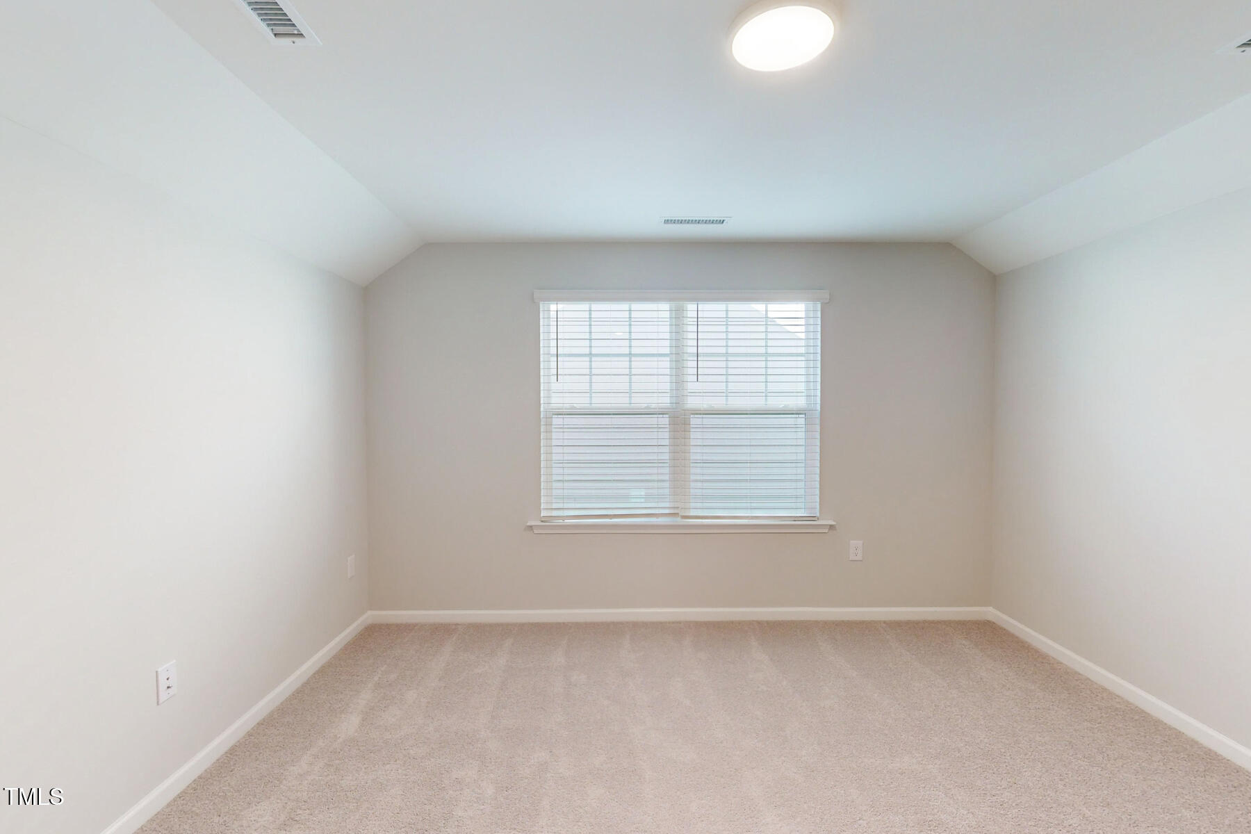 7701 Litcham Drive Raleigh, NC 27615 - Photo 46 of 58 an empty room with a window