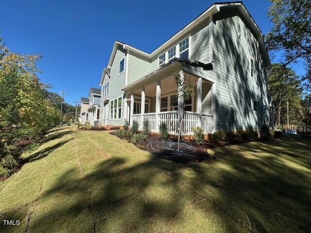 7701 Litcham Drive Raleigh, NC 27615 - Photo 52 of 58 a view of a house with a yard