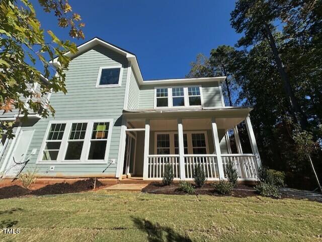 7701 Litcham Drive Raleigh, NC 27615 - Photo 53 of 58 a front view of a house with a yard