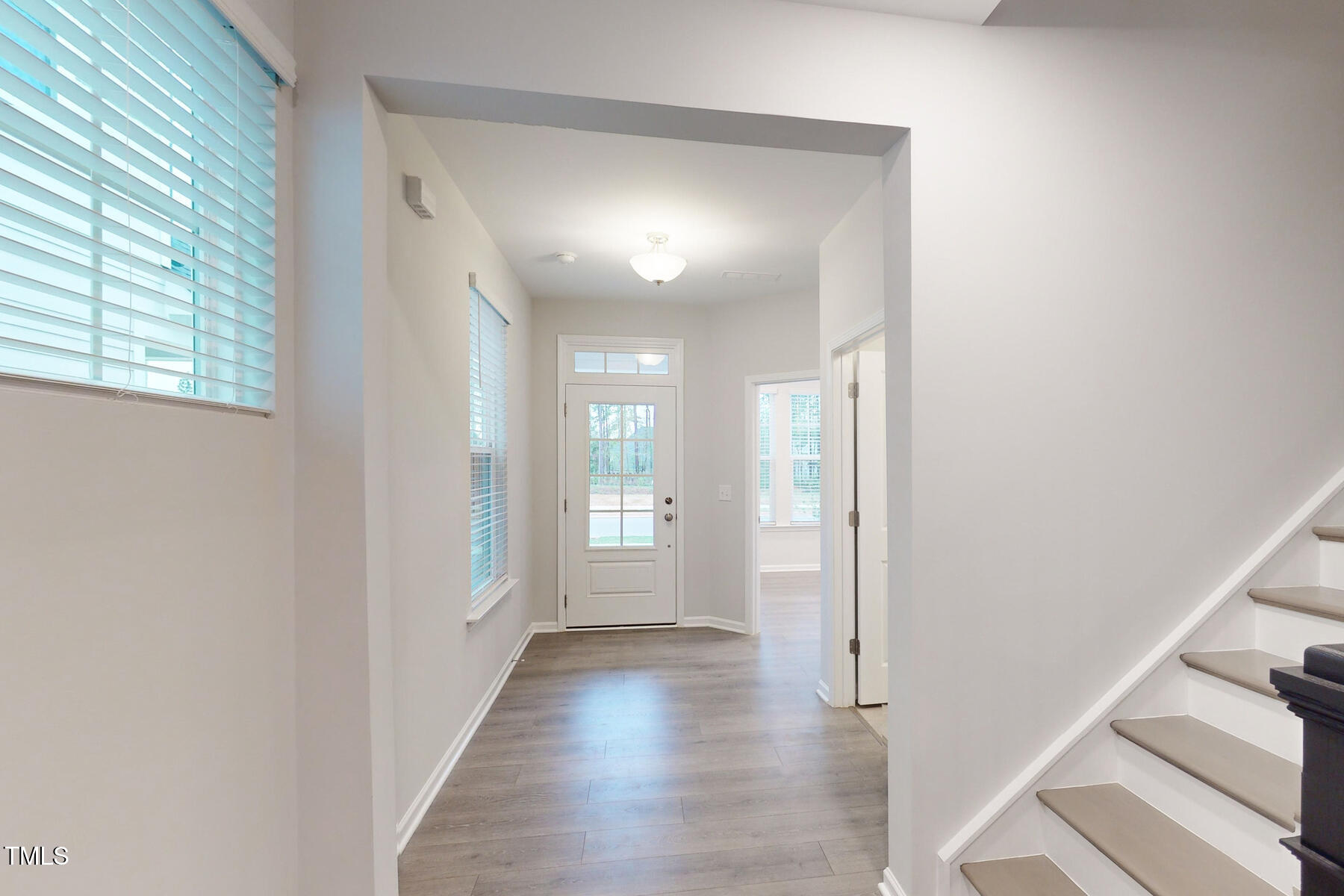 7701 Litcham Drive Raleigh, NC 27615 - Photo 6 of 58 a view of hallway with windows