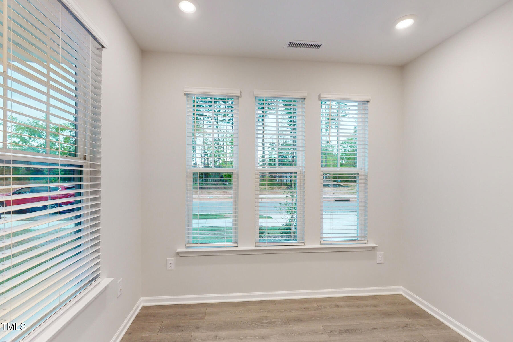 7701 Litcham Drive Raleigh, NC 27615 - Photo 9 of 58 a view of a room that has a window in it