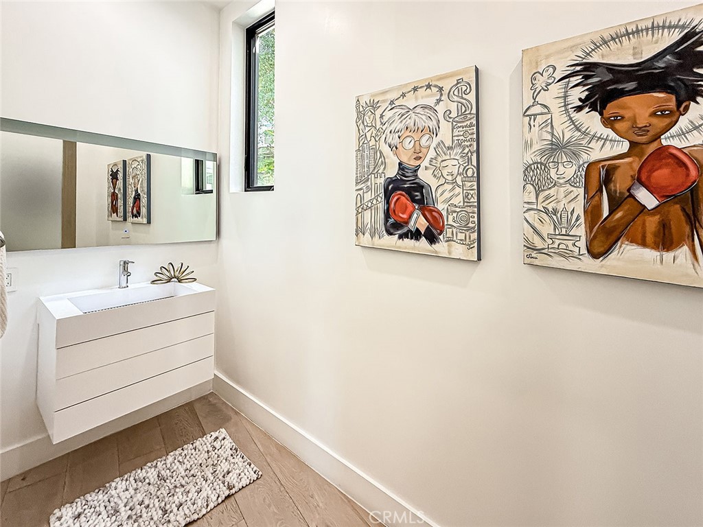 158 Bell Cyn Road Bell Canyon, CA 91307 - Photo 12 of 53 a bathroom with a sink and a picture on the wall