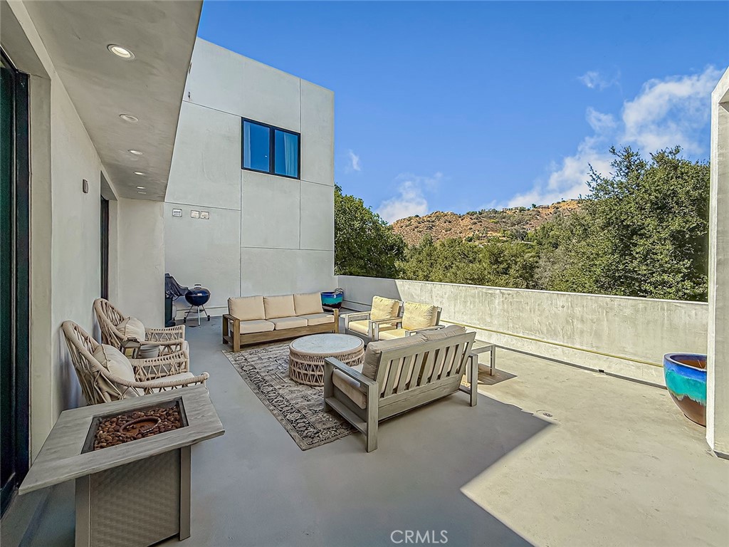 158 Bell Cyn Road Bell Canyon, CA 91307 - Photo 18 of 53 a balcony with furniture and a potted plant