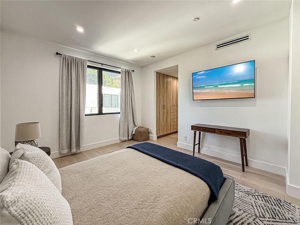 158 Bell Cyn Road Bell Canyon, CA 91307 - Photo 22 of 53 a bedroom with a bed and a night stand