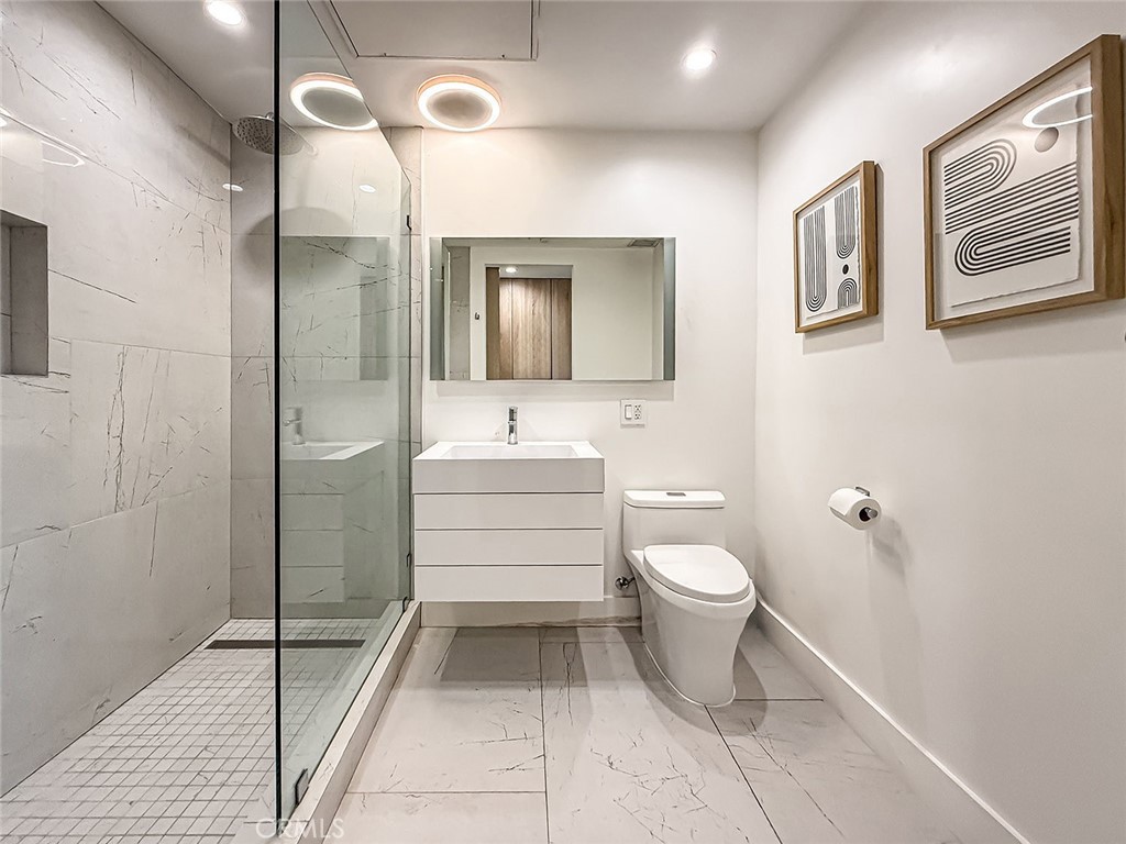 158 Bell Cyn Road Bell Canyon, CA 91307 - Photo 23 of 53 a bathroom with a toilet sink and mirror