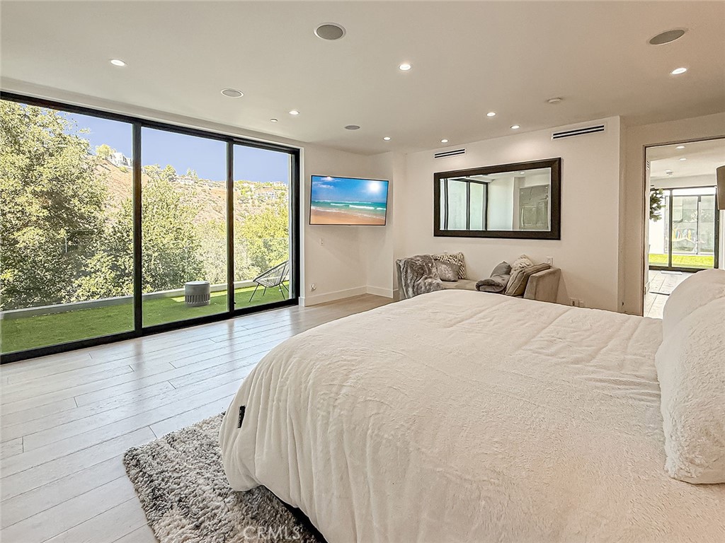 158 Bell Cyn Road Bell Canyon, CA 91307 - Photo 25 of 53 a bedroom with a large bed and a large window