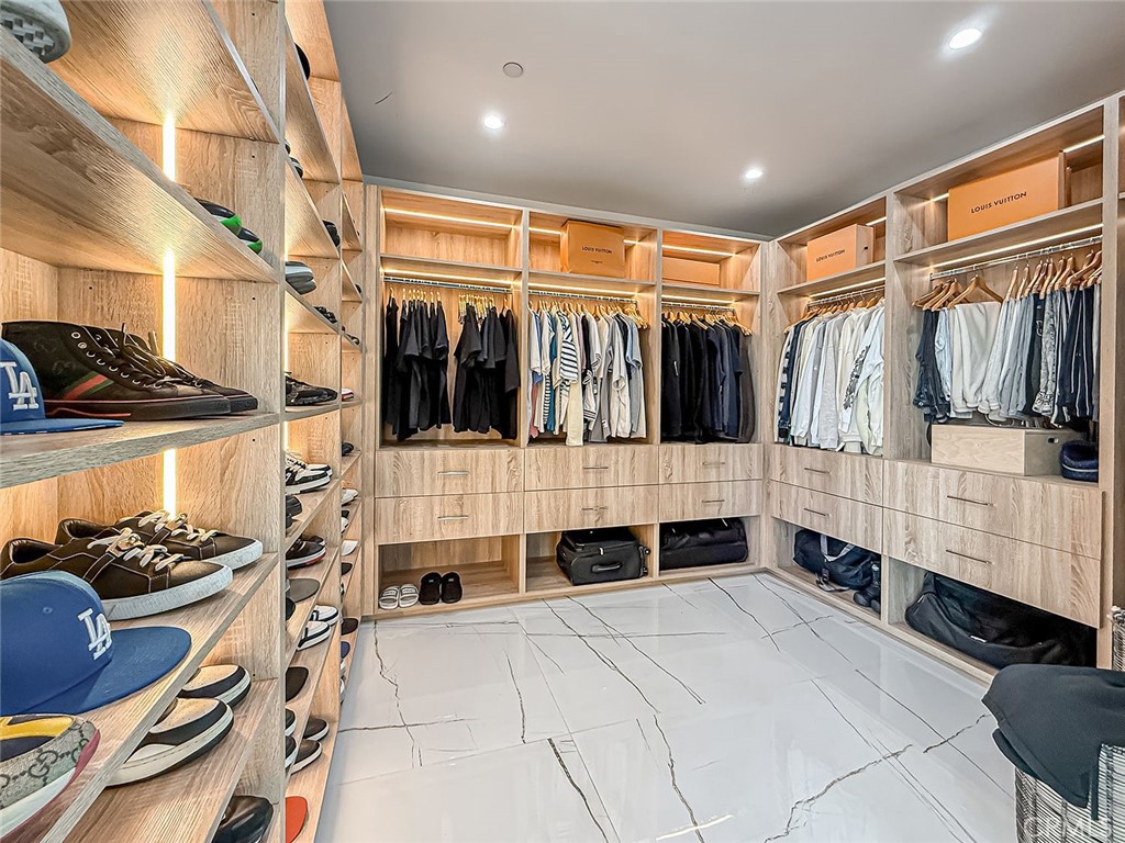158 Bell Cyn Road Bell Canyon, CA 91307 - Photo 29 of 53 a view of walk in closet with clothes and shoes
