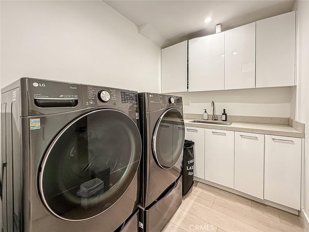 158 Bell Cyn Road Bell Canyon, CA 91307 - Photo 31 of 53 a utility room with sink dryer and washer