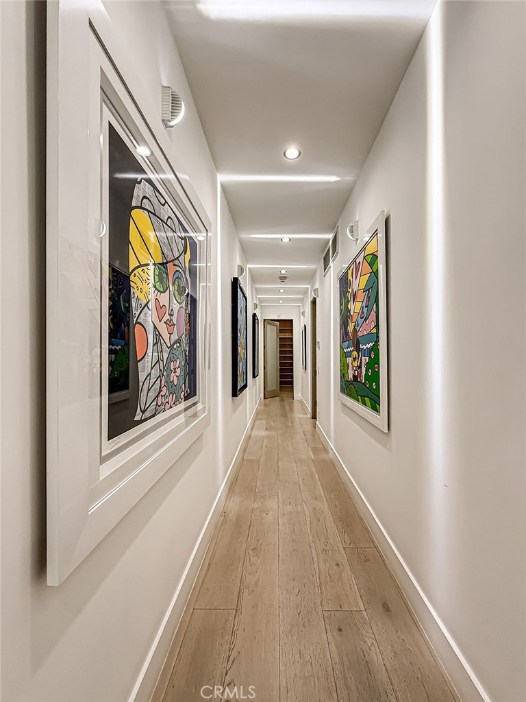 158 Bell Cyn Road Bell Canyon, CA 91307 - Photo 34 of 53 a view of a hallway with paintings on the wall