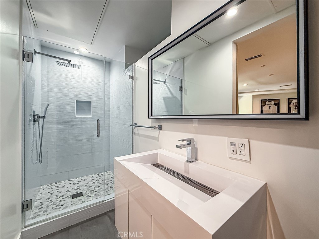 158 Bell Cyn Road Bell Canyon, CA 91307 - Photo 46 of 53 a bathroom with a sink a mirror and a shower