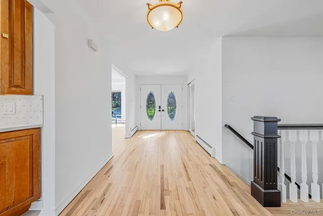 a view of gallery and wooden floor
