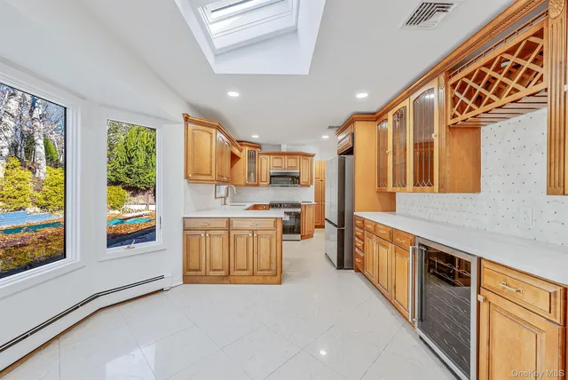 a kitchen with stainless steel appliances granite countertop a stove and a sink