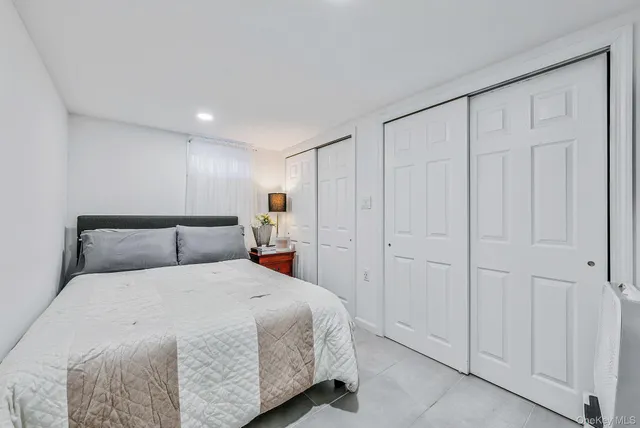 a bedroom with a bed and a closet