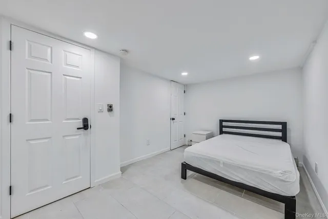 a room with a bed and painted walls