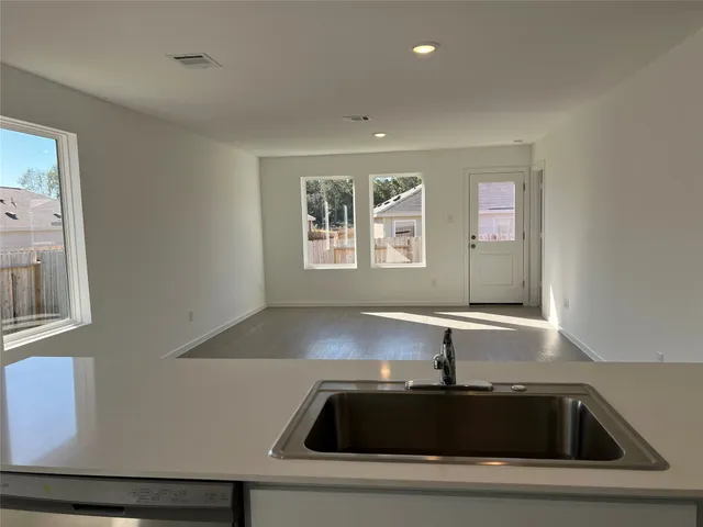 a kitchen with a sink and a window