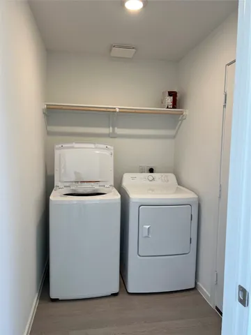 a utility room with dryer and washer