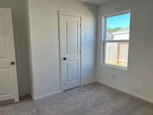 an empty room that has a window