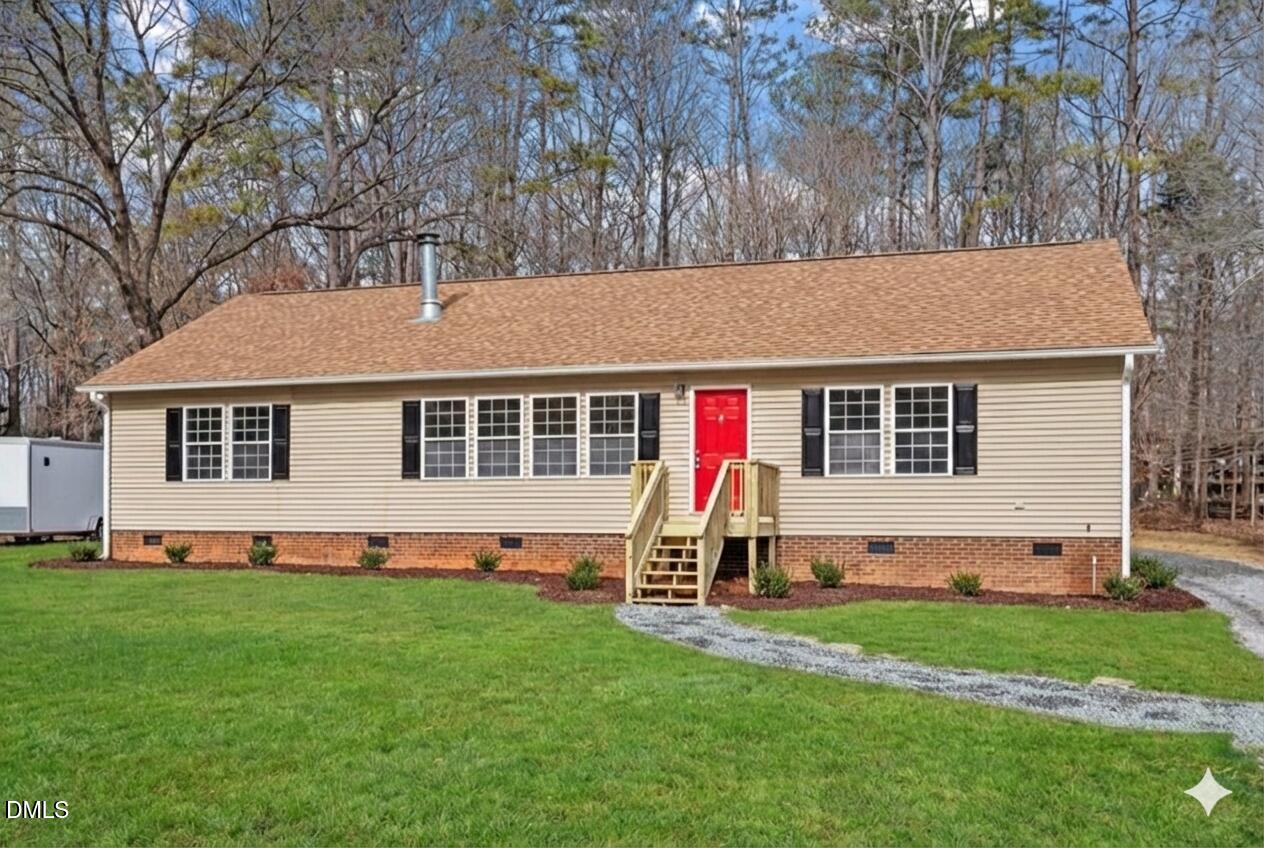 4720 Brigadoon Drive Durham, NC 27705 - Photo 1 of 25 a front view of house with yard