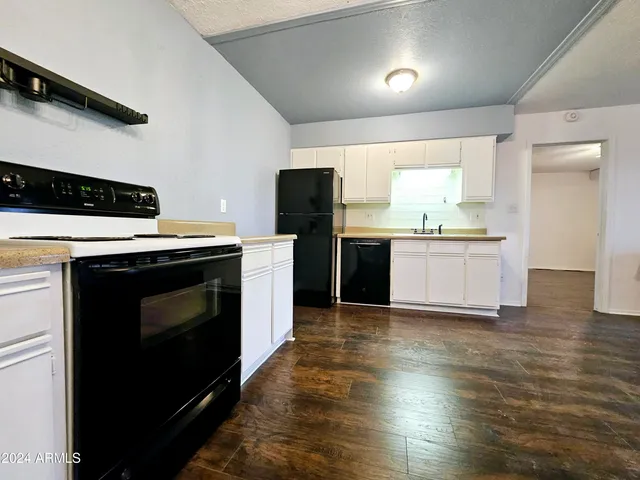 a kitchen with a stove and a microwave