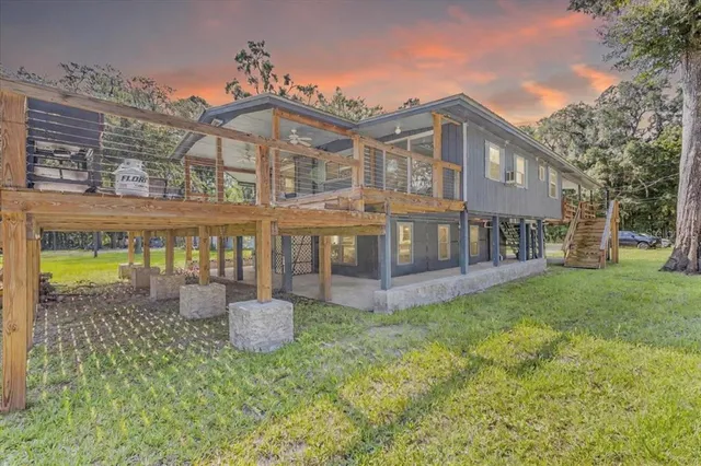 a front view of a house with a garden and patio