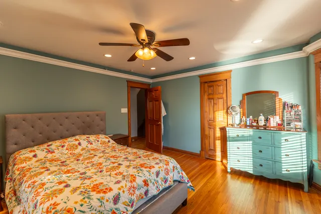 a bedroom with a bed and a dresser