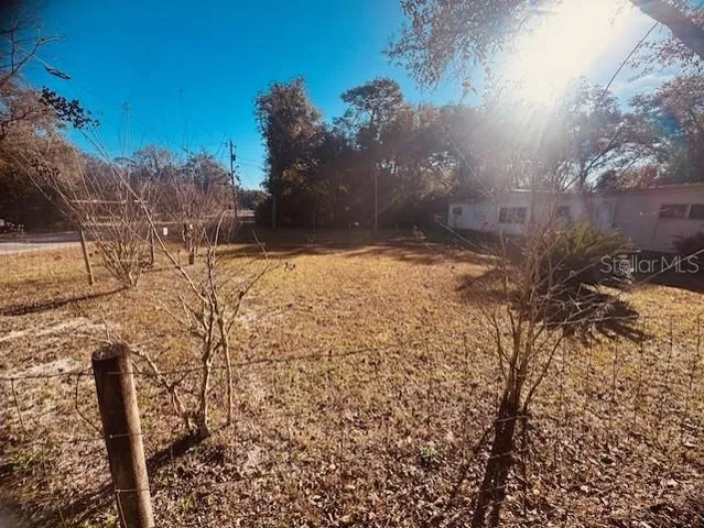 a view of a yard covered in snow