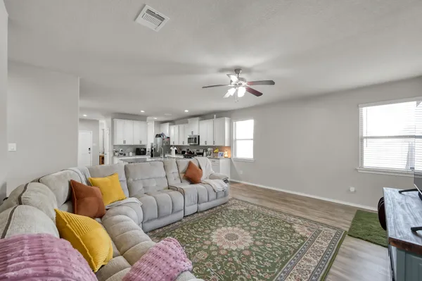 a living room with furniture and a rug
