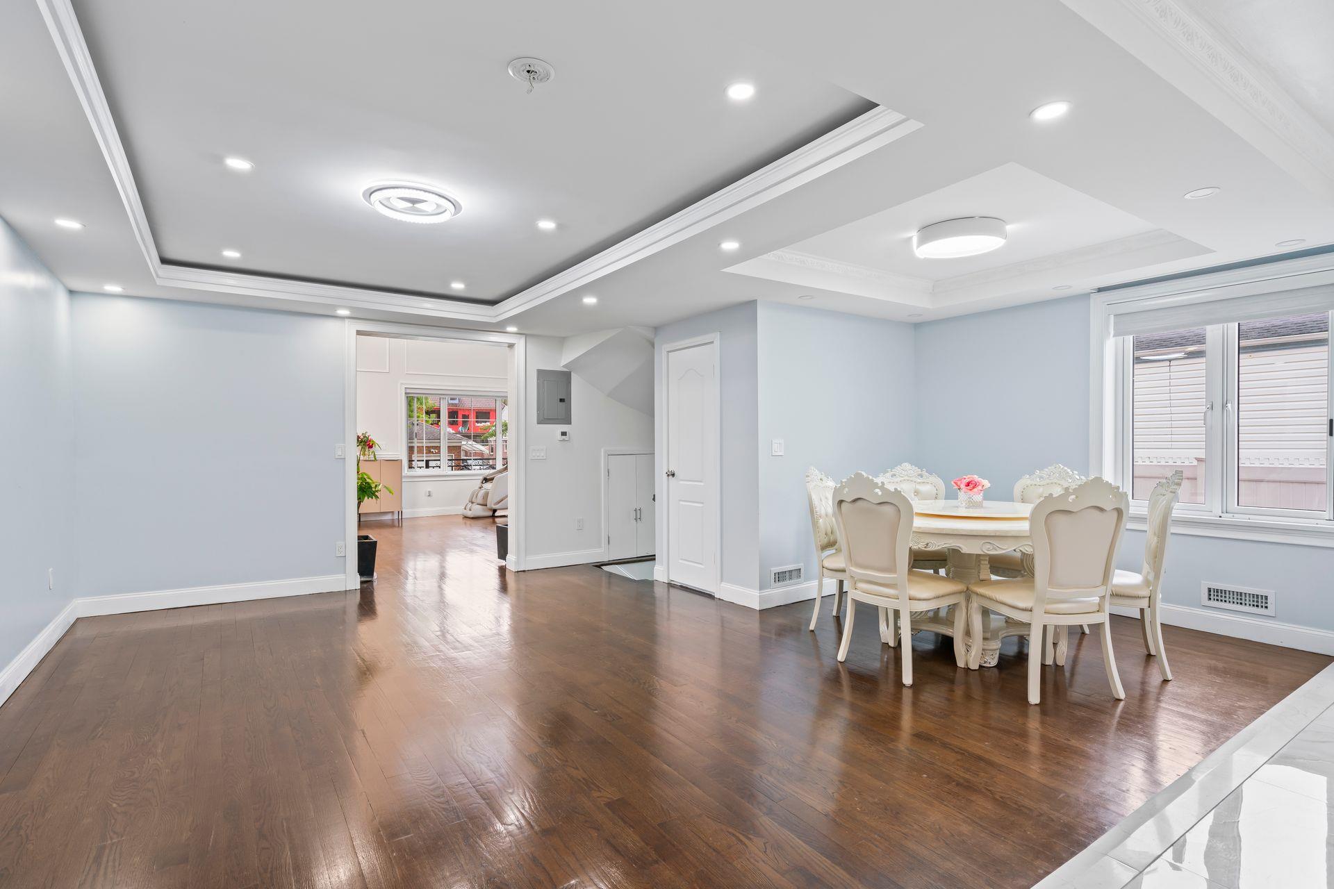 63-41 252nd Street Queens, NY 11362 - Photo 11 of 39 a view of a dining room with furniture and wooden floor